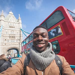 Tourist in front of Tower Bridge, London