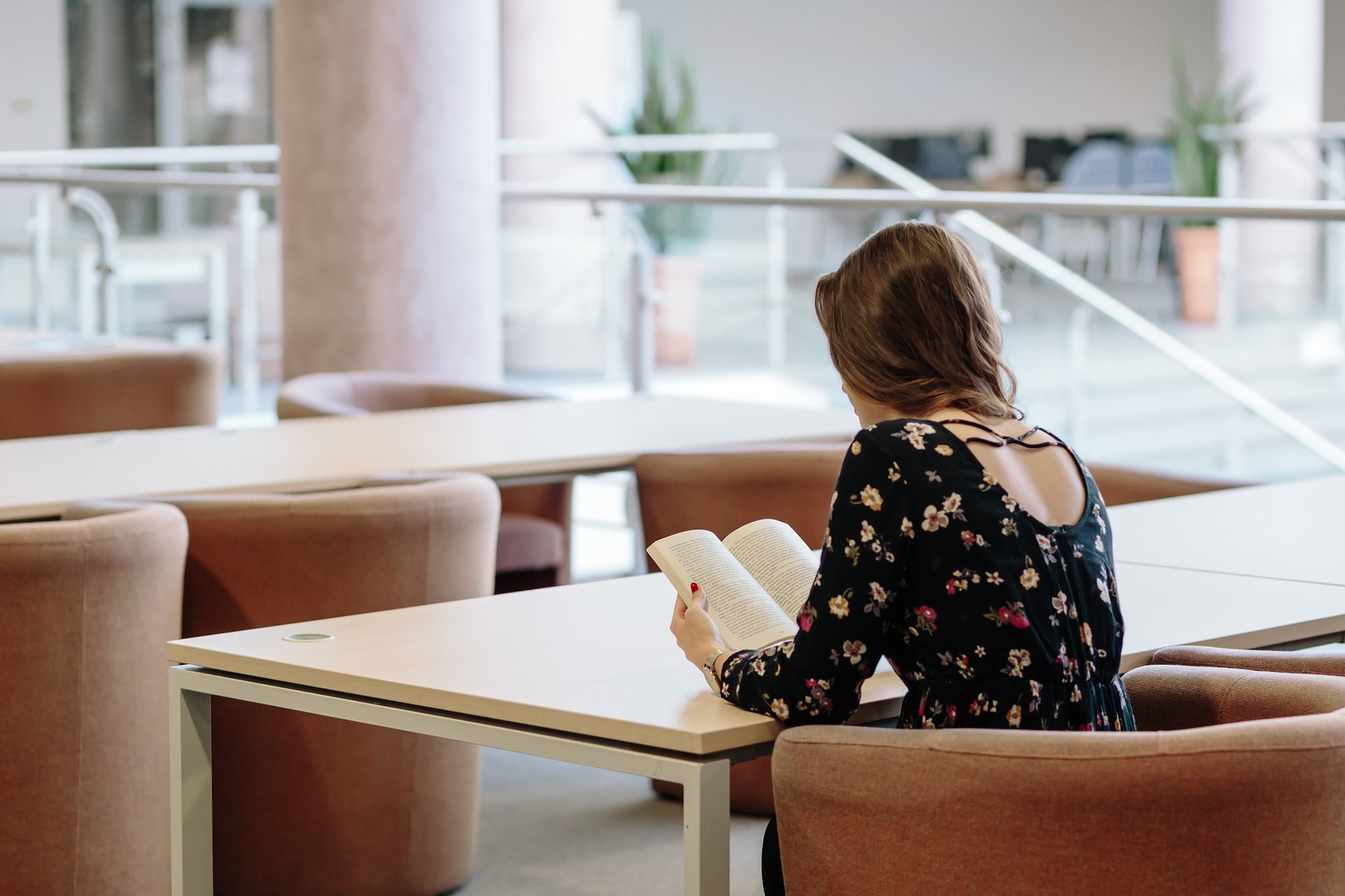 female accommodation reading a book